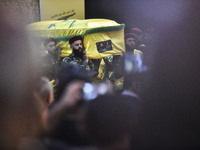 Hezbollah fighters and mourners are attending the funeral ceremony of slain top commander Fuad Shukr in Beirut's southern suburbs, on August...