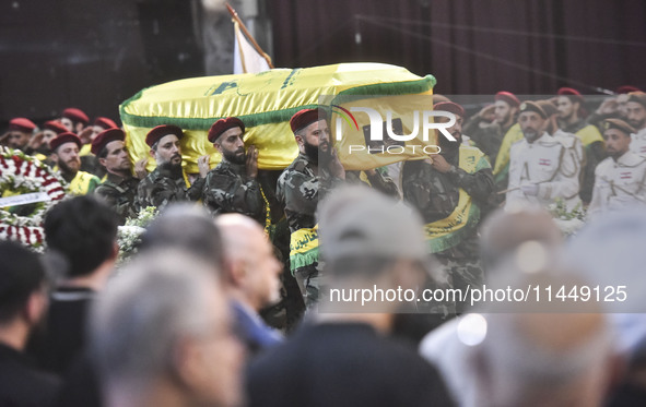 Hezbollah fighters and mourners are attending the funeral ceremony of slain top commander Fuad Shukr in Beirut's southern suburbs, on August...