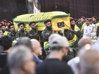 Hezbollah fighters and mourners are attending the funeral ceremony of slain top commander Fuad Shukr in Beirut's southern suburbs, on August...