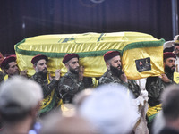 Hezbollah fighters and mourners are attending the funeral ceremony of slain top commander Fuad Shukr in Beirut's southern suburbs, on August...