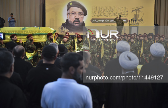 Hezbollah fighters and mourners are attending the funeral ceremony of slain top commander Fuad Shukr in Beirut's southern suburbs, on August...