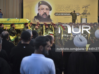 Hezbollah fighters and mourners are attending the funeral ceremony of slain top commander Fuad Shukr in Beirut's southern suburbs, on August...