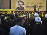 Hezbollah fighters and mourners are attending the funeral ceremony of slain top commander Fuad Shukr in Beirut's southern suburbs, on August...