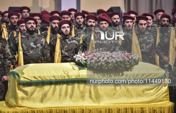 Hezbollah fighters and mourners are attending the funeral ceremony of slain top commander Fuad Shukr in Beirut's southern suburbs, on August...