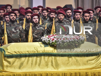 Hezbollah fighters and mourners are attending the funeral ceremony of slain top commander Fuad Shukr in Beirut's southern suburbs, on August...