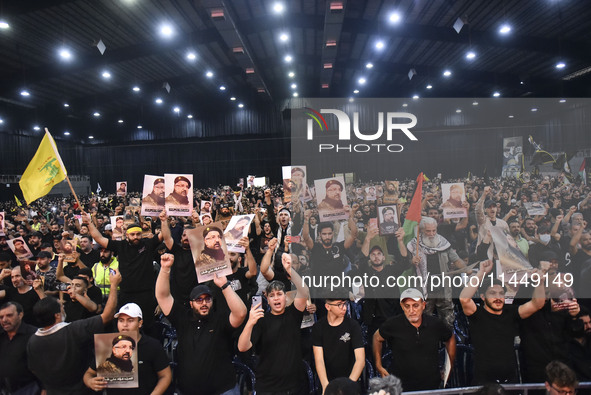 Hezbollah fighters and mourners are attending the funeral ceremony of slain top commander Fuad Shukr in Beirut's southern suburbs, on August...