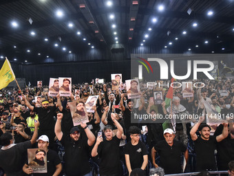 Hezbollah fighters and mourners are attending the funeral ceremony of slain top commander Fuad Shukr in Beirut's southern suburbs, on August...