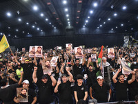 Hezbollah fighters and mourners are attending the funeral ceremony of slain top commander Fuad Shukr in Beirut's southern suburbs, on August...