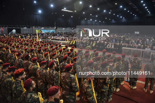 Hezbollah fighters and mourners are attending the funeral ceremony of slain top commander Fuad Shukr in Beirut's southern suburbs, on August...