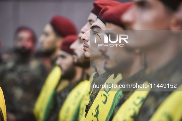 Hezbollah fighters and mourners are attending the funeral ceremony of slain top commander Fuad Shukr in Beirut's southern suburbs, on August...