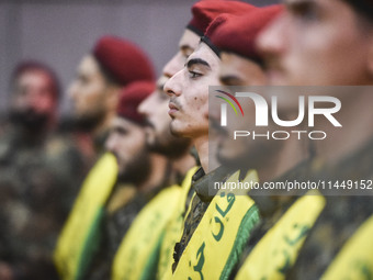 Hezbollah fighters and mourners are attending the funeral ceremony of slain top commander Fuad Shukr in Beirut's southern suburbs, on August...