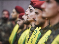 Hezbollah fighters and mourners are attending the funeral ceremony of slain top commander Fuad Shukr in Beirut's southern suburbs, on August...