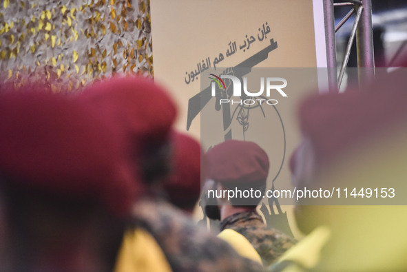 Hezbollah fighters and mourners are attending the funeral ceremony of slain top commander Fuad Shukr in Beirut's southern suburbs, on August...