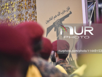 Hezbollah fighters and mourners are attending the funeral ceremony of slain top commander Fuad Shukr in Beirut's southern suburbs, on August...