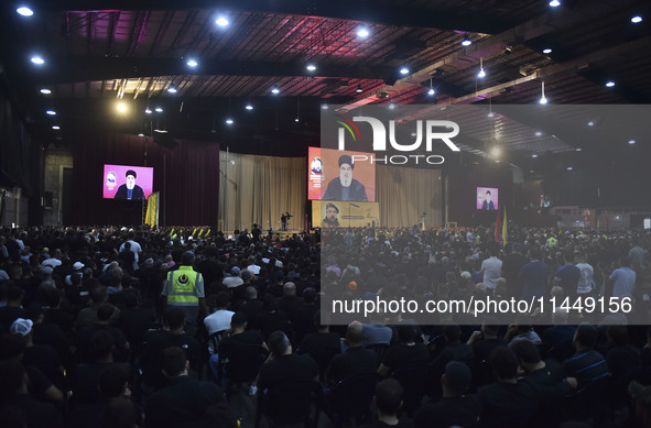 Hezbollah fighters and mourners are attending the funeral ceremony of slain top commander Fuad Shukr in Beirut's southern suburbs, on August...