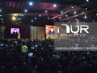 Hezbollah fighters and mourners are attending the funeral ceremony of slain top commander Fuad Shukr in Beirut's southern suburbs, on August...