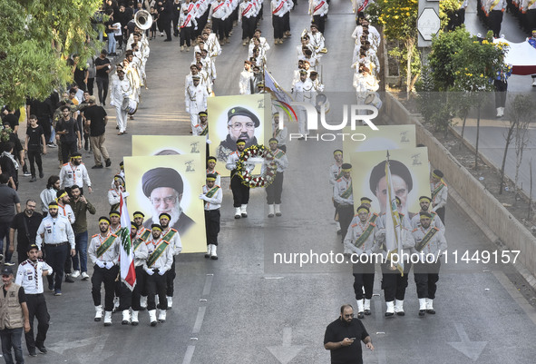 Hezbollah fighters and mourners are attending the funeral ceremony of slain top commander Fuad Shukr in Beirut's southern suburbs, on August...