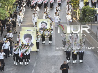 Hezbollah fighters and mourners are attending the funeral ceremony of slain top commander Fuad Shukr in Beirut's southern suburbs, on August...