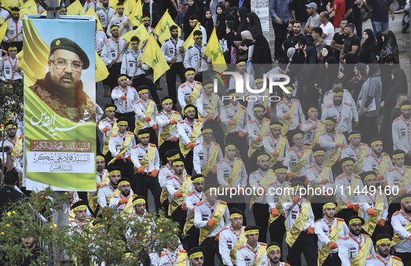 Hezbollah fighters and mourners are attending the funeral ceremony of slain top commander Fuad Shukr in Beirut's southern suburbs, on August...