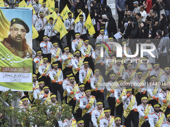 Hezbollah fighters and mourners are attending the funeral ceremony of slain top commander Fuad Shukr in Beirut's southern suburbs, on August...