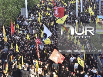 Hezbollah fighters and mourners are attending the funeral ceremony of slain top commander Fuad Shukr in Beirut's southern suburbs, on August...