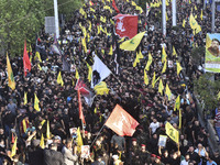 Hezbollah fighters and mourners are attending the funeral ceremony of slain top commander Fuad Shukr in Beirut's southern suburbs, on August...