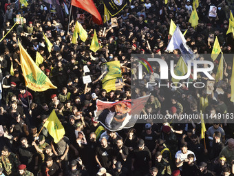 Hezbollah fighters and mourners are attending the funeral ceremony of slain top commander Fuad Shukr in Beirut's southern suburbs, on August...