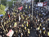 Hezbollah fighters and mourners are attending the funeral ceremony of slain top commander Fuad Shukr in Beirut's southern suburbs, on August...