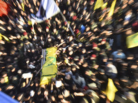 Hezbollah fighters and mourners are attending the funeral ceremony of slain top commander Fuad Shukr in Beirut's southern suburbs, on August...