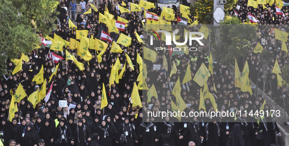 Hezbollah fighters and mourners are attending the funeral ceremony of slain top commander Fuad Shukr in Beirut's southern suburbs, on August...