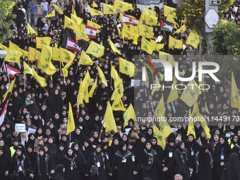 Hezbollah fighters and mourners are attending the funeral ceremony of slain top commander Fuad Shukr in Beirut's southern suburbs, on August...