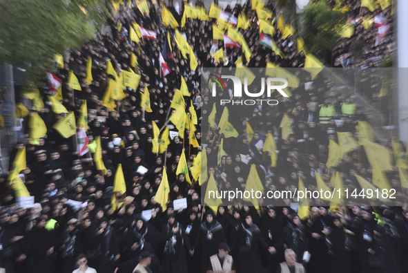 Hezbollah fighters and mourners are attending the funeral ceremony of slain top commander Fuad Shukr in Beirut's southern suburbs, on August...