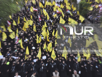 Hezbollah fighters and mourners are attending the funeral ceremony of slain top commander Fuad Shukr in Beirut's southern suburbs, on August...