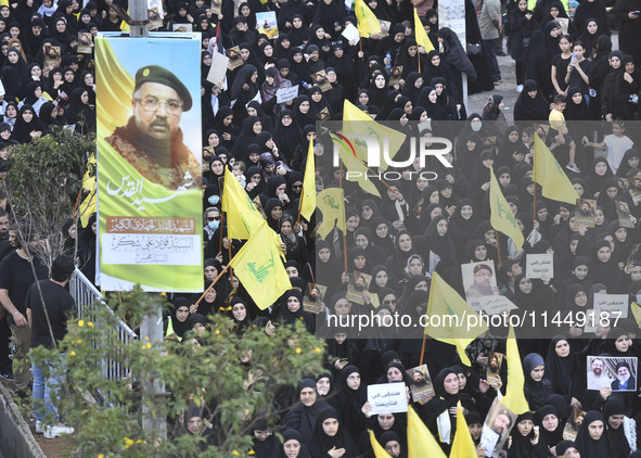 Hezbollah fighters and mourners are attending the funeral ceremony of slain top commander Fuad Shukr in Beirut's southern suburbs, on August...