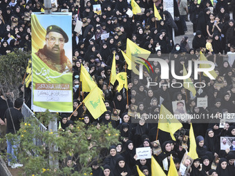 Hezbollah fighters and mourners are attending the funeral ceremony of slain top commander Fuad Shukr in Beirut's southern suburbs, on August...