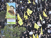 Hezbollah fighters and mourners are attending the funeral ceremony of slain top commander Fuad Shukr in Beirut's southern suburbs, on August...