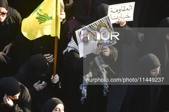 Hezbollah fighters and mourners are attending the funeral ceremony of slain top commander Fuad Shukr in Beirut's southern suburbs, on August...