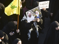 Hezbollah fighters and mourners are attending the funeral ceremony of slain top commander Fuad Shukr in Beirut's southern suburbs, on August...