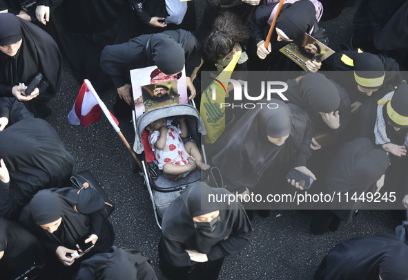 Hezbollah fighters and mourners are attending the funeral ceremony of slain top commander Fuad Shukr in Beirut's southern suburbs, on August...