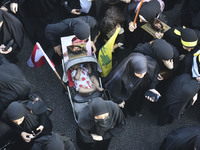 Hezbollah fighters and mourners are attending the funeral ceremony of slain top commander Fuad Shukr in Beirut's southern suburbs, on August...