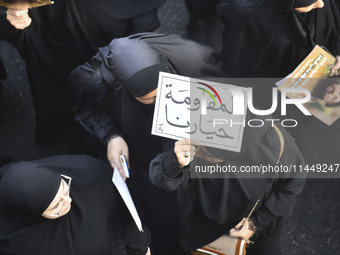 Hezbollah fighters and mourners are attending the funeral ceremony of slain top commander Fuad Shukr in Beirut's southern suburbs, on August...