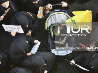 Hezbollah fighters and mourners are attending the funeral ceremony of slain top commander Fuad Shukr in Beirut's southern suburbs, on August...