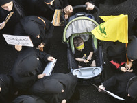 Hezbollah fighters and mourners are attending the funeral ceremony of slain top commander Fuad Shukr in Beirut's southern suburbs, on August...