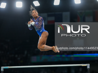 Simone Biles of United States performing on the Uneven Bars during  the Artistic Gymnastics Women's All-Around Final on day six of the Olymp...