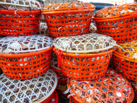 Workers are loading and unloading swimming crabs at the dock of Zhoushan International Aquatic City in Zhoushan, China, on August 2, 2024. (