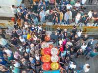 Workers are loading and unloading swimming crabs at the dock of Zhoushan International Aquatic City in Zhoushan, China, on August 2, 2024. (