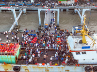 Workers are loading and unloading swimming crabs at the dock of Zhoushan International Aquatic City in Zhoushan, China, on August 2, 2024. (