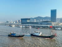 Fishing boats are passing through the dock of Zhoushan International Aquatic City in Zhoushan City, Zhejiang province, in Zhoushan, China, o...