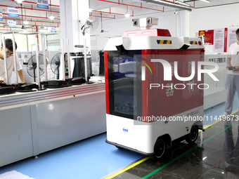 A staff member is debuting a fire intelligent patrol robot at the production line of Fu in Fuzhou, Fujian province, China, on August 1, 2024...