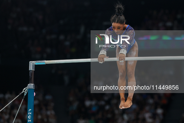 Simone Biles of United States performing on the Uneven Bars during  the Artistic Gymnastics Women's All-Around Final on day six of the Olymp...